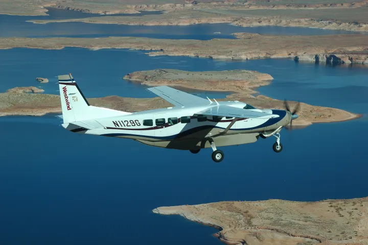 a plane flying over a body of water